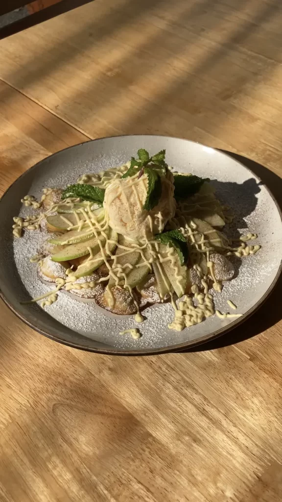 Apple Pie Waffles with ice cream in the sunshine at Poached Rawai Beach, Phuket, Thailand. Plus, it's a great place to visit if you're looking for a vegetarian brunch in Rawai.