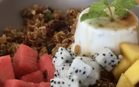 Breakfast pannacotta with homemade granola, watermelon, mango and dragonfruit at Poached Rawai Beach, Phuket, Thailand.