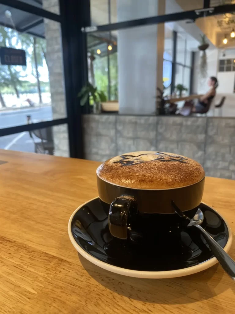 A delicious mocha on the table at the spot that answers the question, 'What to eat in Nai Harn?'  Poached Breakfast Cafe Rawai, Phuket, Thailand