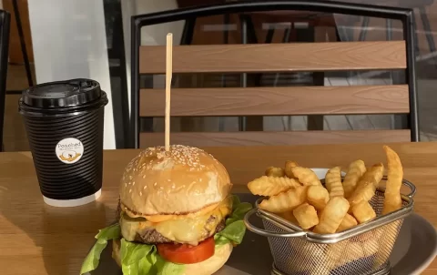 One of the best tourist attractions in Naiharn might just be this burger and french fries with a coffee in the sunshine at Poached Breakfast Cafe Rawai, Phuket, Thailand