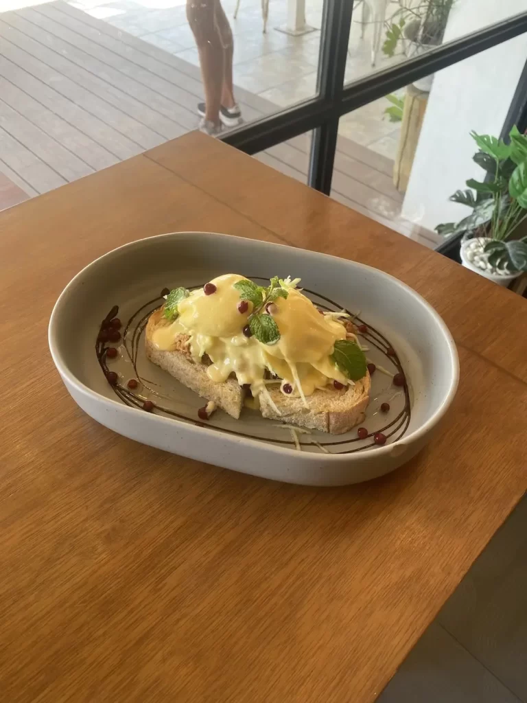 Pulled Pork Eggs benedict with fresh mint and pomegranate at the spot with the best eggs benedict in Rawai: Poached Breakfast Cafe, Rawai, Phuket, Thailand