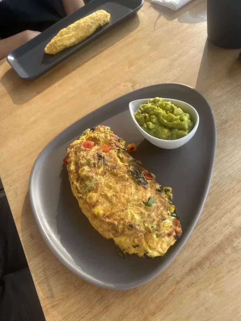 Spicy Mexican flavours in an omelette with smashed avocado on the side. This is the perfect meal after visiting one of the great gyms near Nai Harn. Only at Poached Breakfast Cafe, Rawai, Phuket, Thailand
