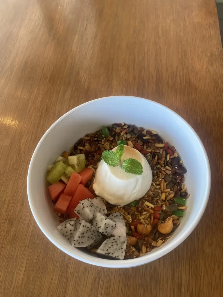 A bowl of delicious vanilla  Panna Cotta and Museli Granola at the place with the best ground coffee near Nai Harn: Poached Breakfast Cafe Rawai, Phuket, Thailand