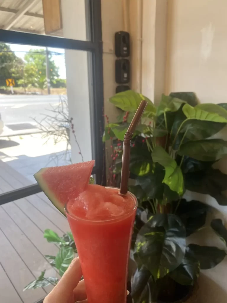 Watermelon smoothie by the window at the spot with the best omelette near Nai Harn, Poached Breakfast Cafe Rawai, Phuket, Thailand