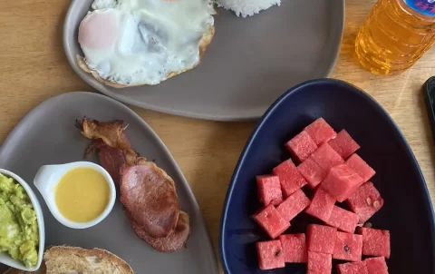 Fruit, rice, eggs, avocado, bacon and watermelon at Poached Breakfast Cafe Rawai: a fantastic breakfast before heading out on one of the island tours in Rawai.