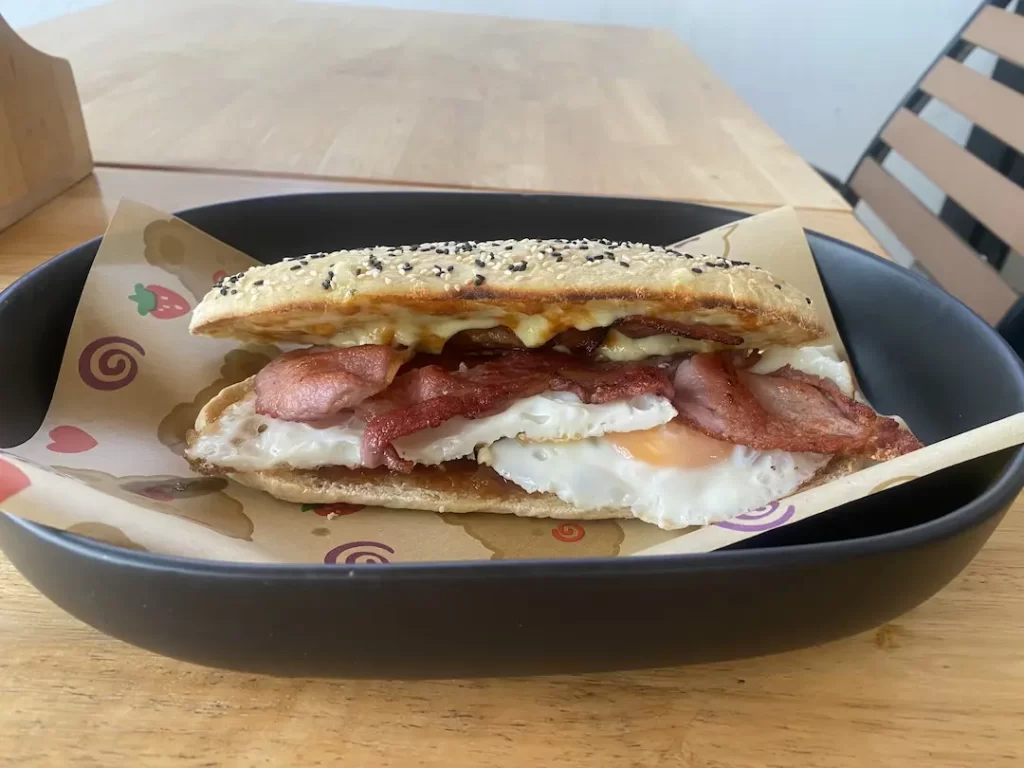 Bacon and egg sandwich on homemade bread at the best place to fuel up before going trekking near Nai Harn: Poached Breakfast Cafe Rawai, Phuket, Thailand