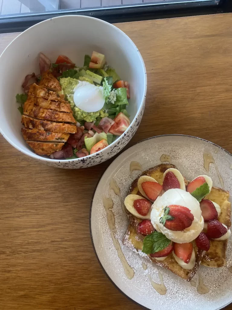 Chicken cobb salad with french toast and fresh fruit at the spot to eat at before visiting the best viewpoints near Nai Harn: Poached Breakfast Cafe Rawai, Phuket, Thailand