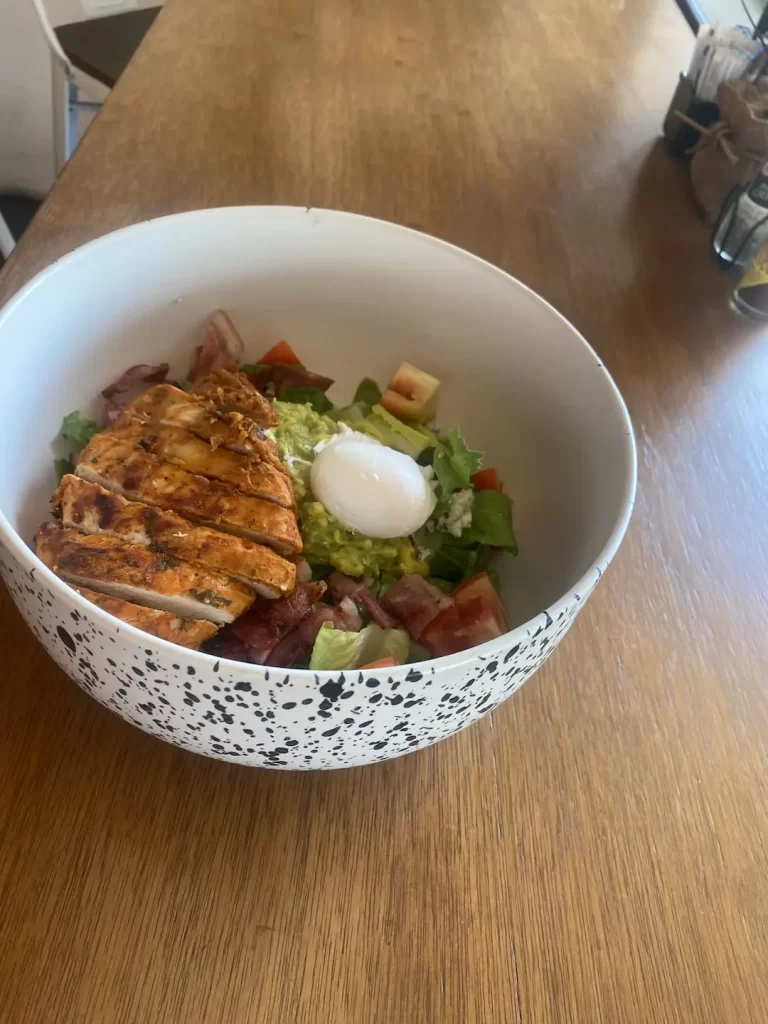 Cobb salad with seasoned grilled chicken, a poached egg and blue cheese dressing. A great spot to eat if you're staying at one of the hotels in Rawai. Only at Poached Breakfast Cafe Rawai, Phuket, Thailand