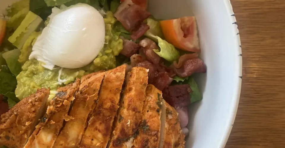 Close up of a chicken cobb salad at the cafe to eat at before you head out on one of the great routes to run in Nai Harn: Poached Breakfast Cafe, Phuket, Thailand