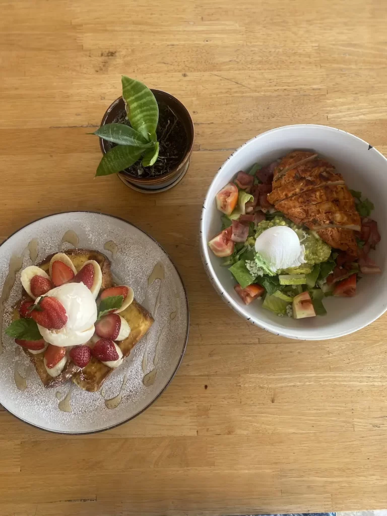 Cobb Salad and French Toast with strawberries and banana at the best place to fuel up before going trekking near Nai Harn: Poached Breakfast Cafe Rawai, Phuket, Thailand