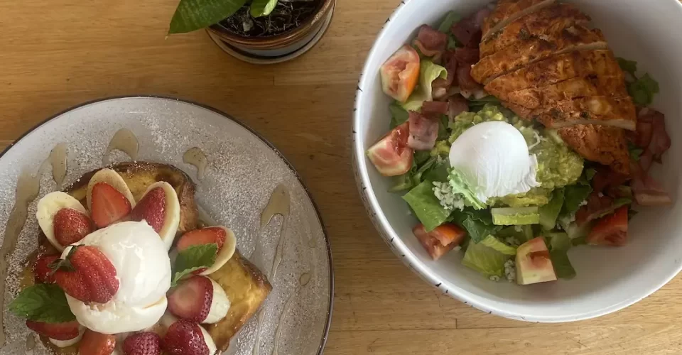 Cobb Salad and French Toast with strawberries and banana at the best place to fuel up before going trekking near Nai Harn: Poached Breakfast Cafe Rawai, Phuket, Thailand