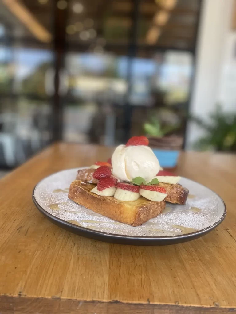 French toast with banana, ice cream and strawberries at one of the best breakfast bars near Nai Harn, Poached Breakfast Cafe Rawai, Phuket, Thailand