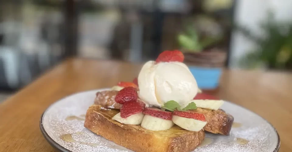 French toast with banana, ice cream and strawberries at one of the best breakfast bars near Nai Harn, Poached Breakfast Cafe Rawai, Phuket, Thailand