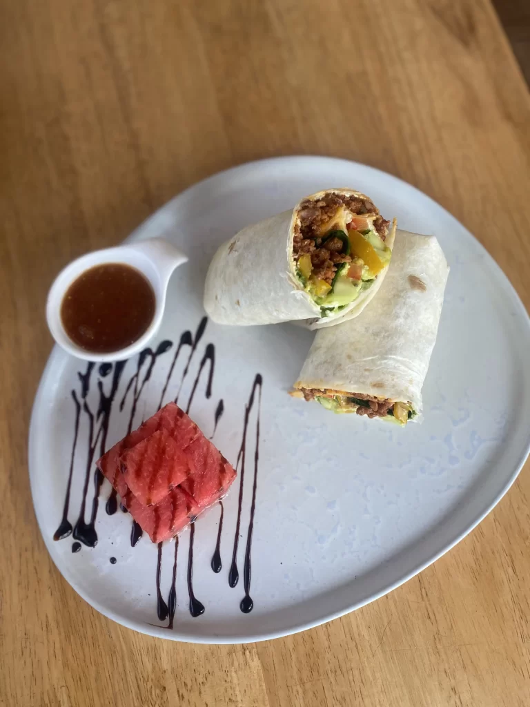 Sausage, avocado and smoky egg wrap with a dipping sauce. This is a great place to eat before checking out spots for motorbike hire in Rawai. Only at Poached Breakfast Cafe Rawai, Phuket, Thailand